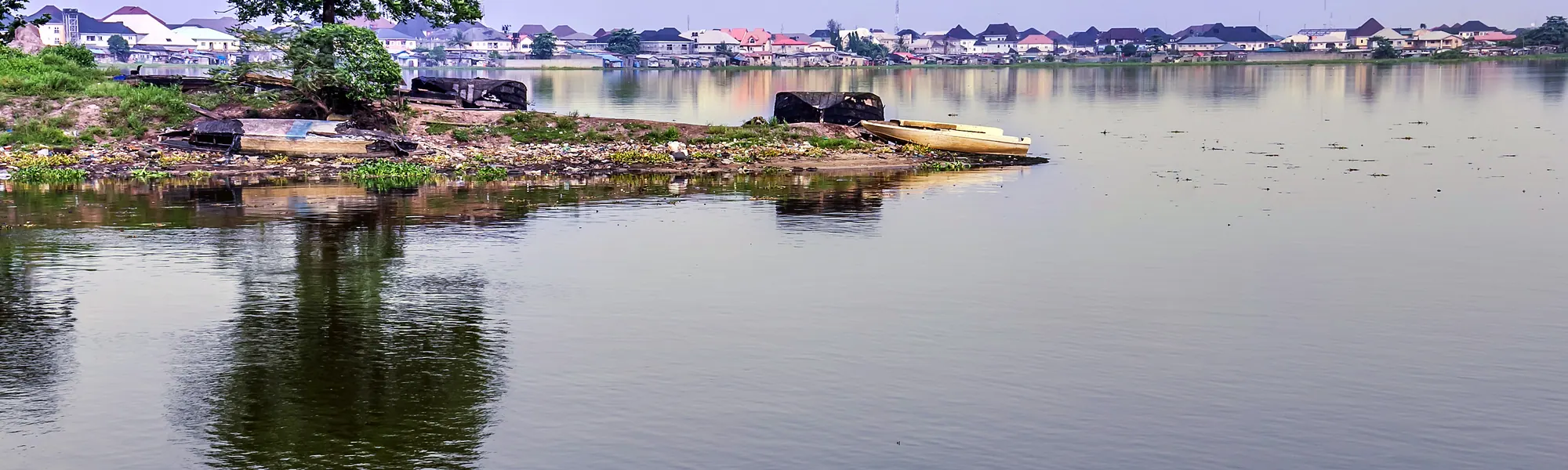 The lagoon front in Festac, Lagos, with houses along the far shore